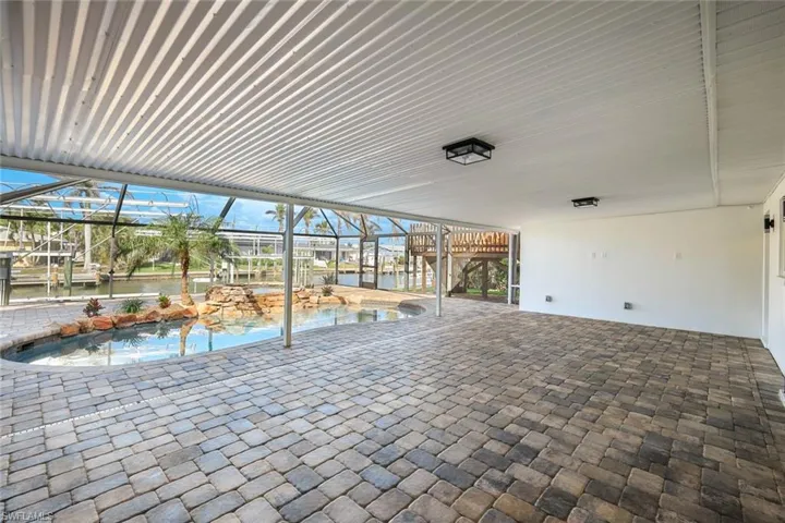 View of patio / terrace featuring a lanai and an outdoor pool