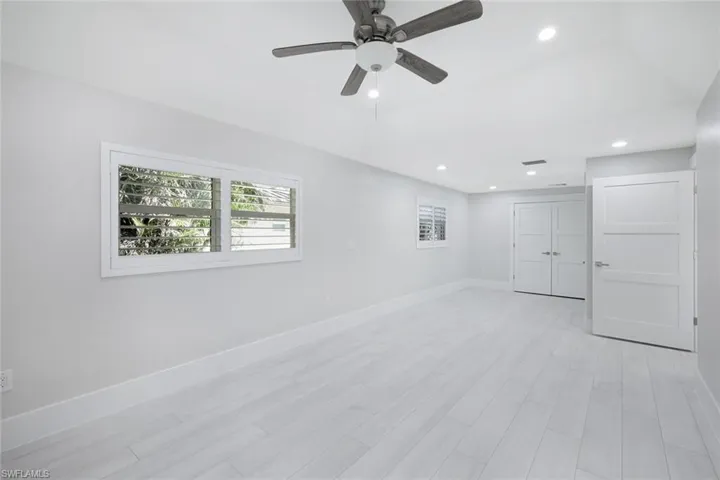 Empty room with recessed lighting, light wood finished floors, baseboards, and a ceiling fan