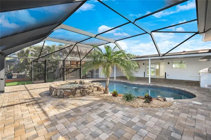 Outdoor pool featuring a lanai and a patio