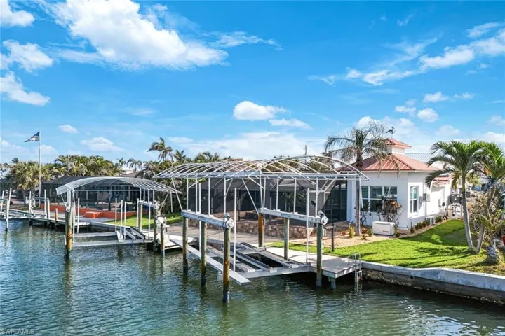 Two Canopy covered boat lifts 16,000 & 12,000 lbs.