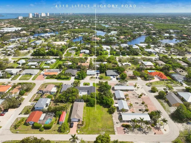 Neighborhood aerial view near shopping and beaches.
