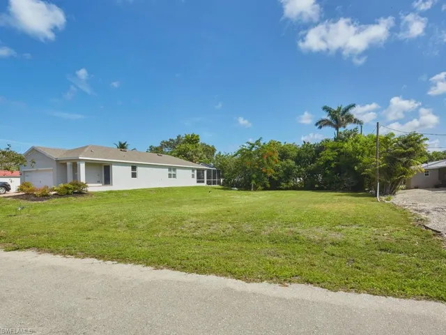 Yard view facing nearby homes on Imperial Shores Blvd.