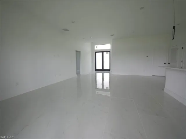 Spare room with light tile flooring