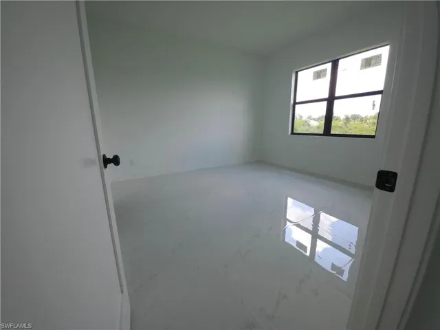 Empty room with tile floors