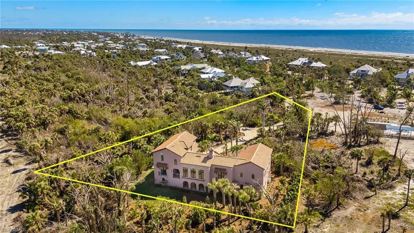 Aerial view of property's location featuring property parcel outlined and extended coastline