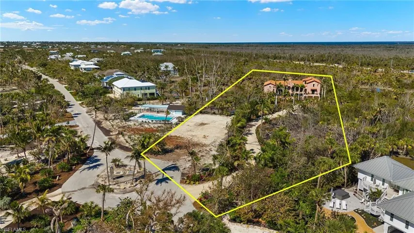 View of property location with property boundaries highlighted and a heavily wooded area