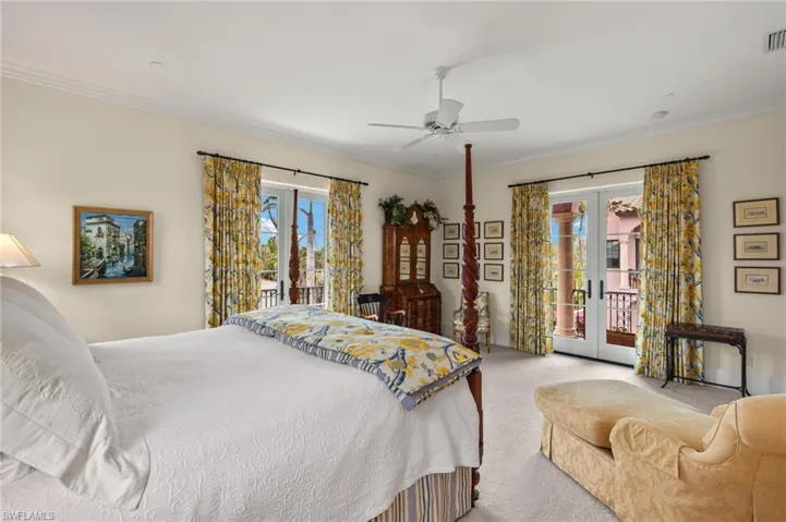 Carpeted bedroom featuring french doors, access to exterior, a ceiling fan, and crown molding