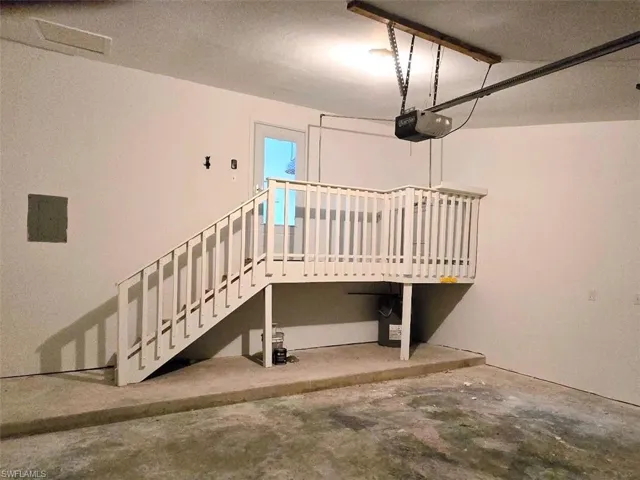 Garage with Stairway to Villa & Washer & Dryer