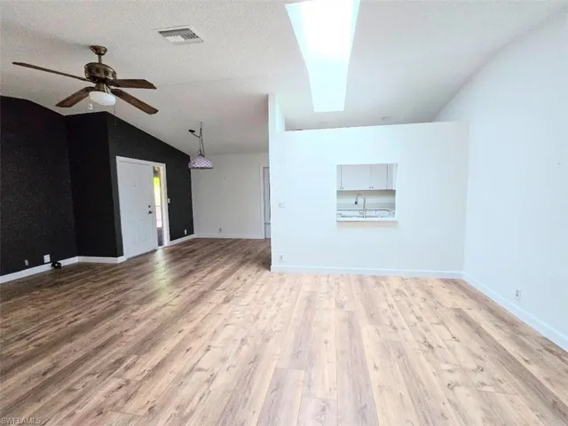 Great Room w/Pass Thru to Kitchen & Skylight