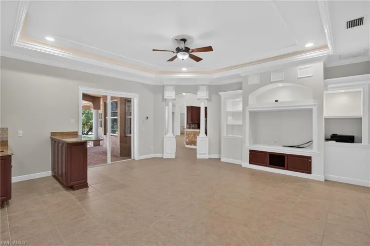 living room, wet bar and sliders to pool