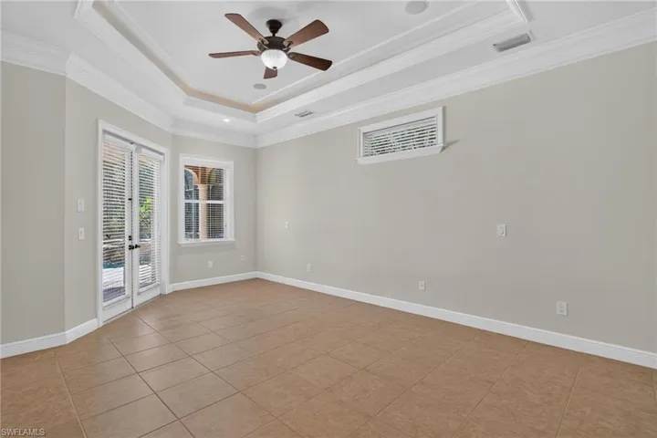 master bedroom with double door to pool