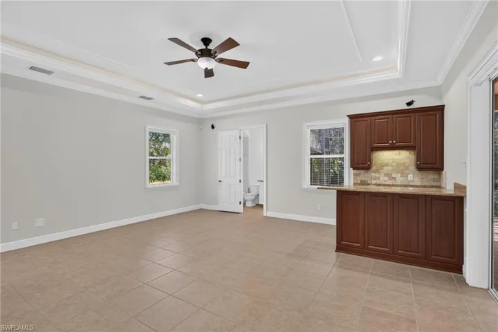 Living room, wet bar and pool bath
