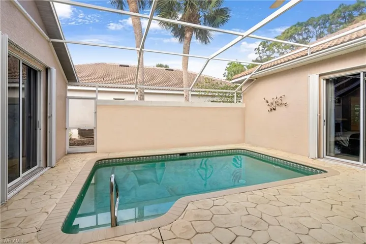 View of pool featuring a lanai and a patio area
