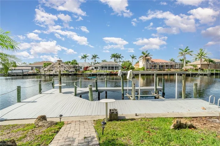 Boat Dock with boat lift, wide expansive water views, tiki hut table (in need of repair)