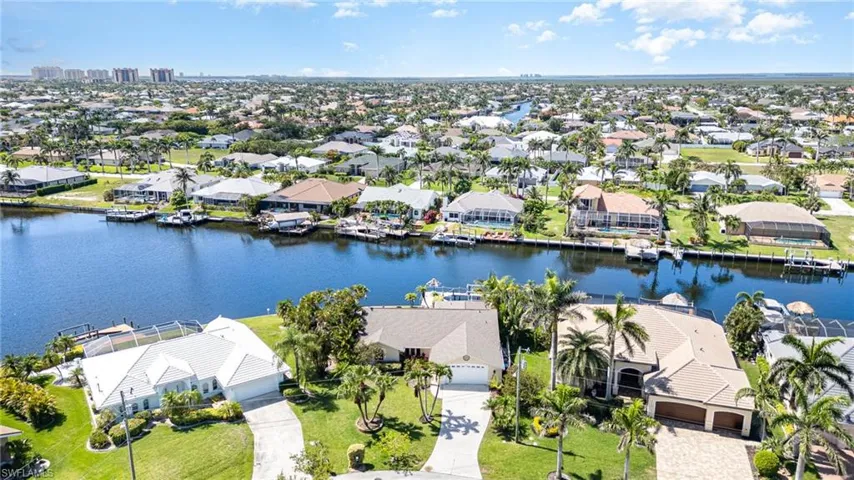 Aerial perspective of suburban area with an intersecting canal view