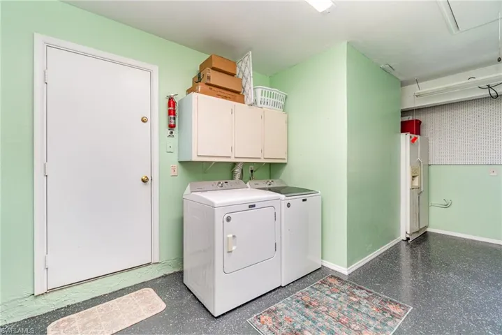 Primary Master Bathroom featuring tile patterned floors, double sink vanity, and private water closet with toilet and shower