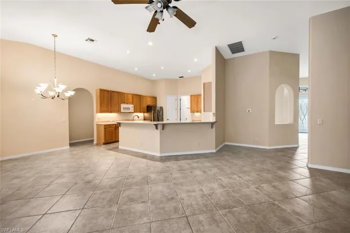 Family room with kitchen in the background