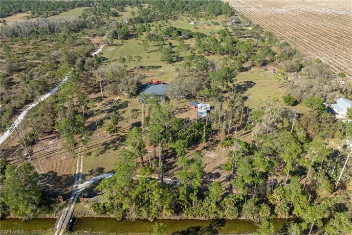 Birds eye view of property featuring a rural view