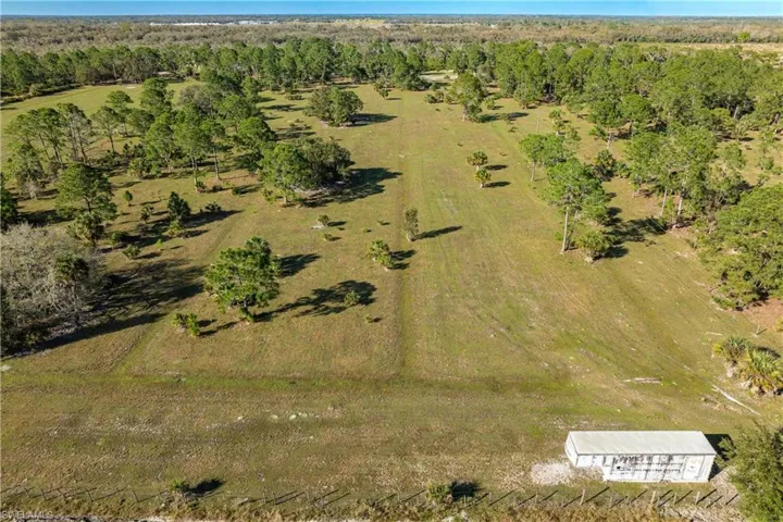 Birds eye view of property with a rural view