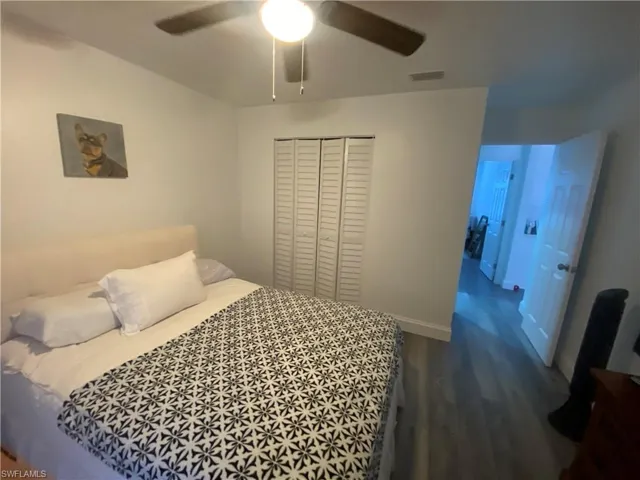Kitchen featuring white cabinetry, stainless steel appliances, and backsplash