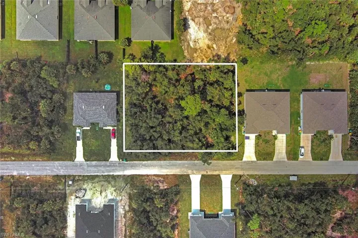 Aerial perspective of suburban area with property parcel outlined