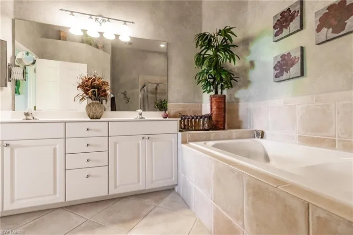 Large bathroom with separate tub and shower