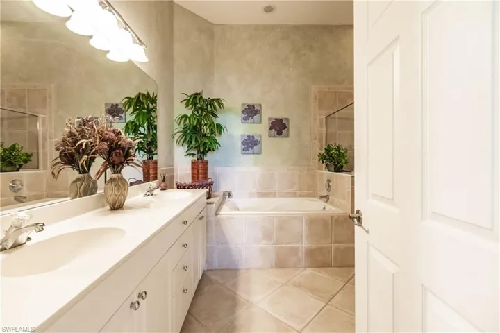 Dual sinks and separate tub in primary bathroom