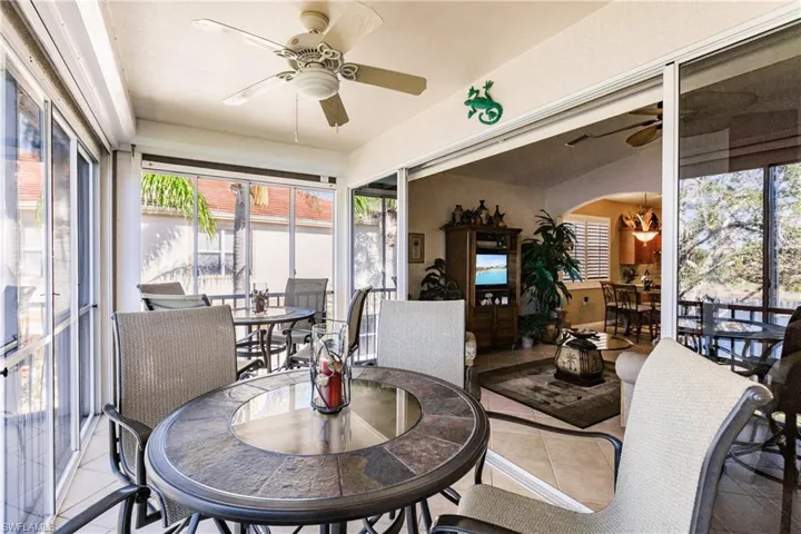 Lanai area with plexiglass enclosure for added living area.