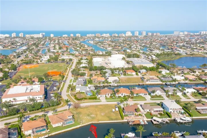 Drone / aerial view with a view of city, a water view, and a residential view