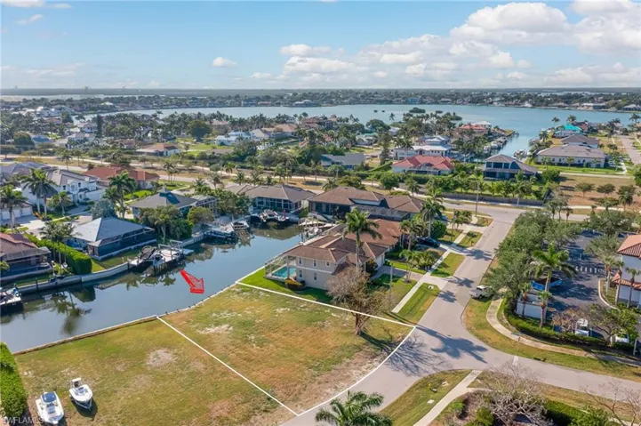 Aerial view featuring a residential view and a water view
