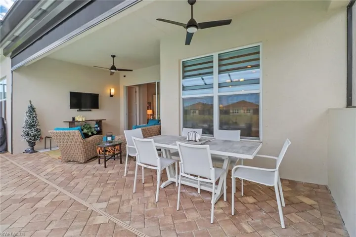 View of patio featuring ceiling fan