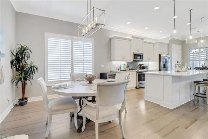 Dining room , light hardwood / wood-style floors, and a wealth of natural light