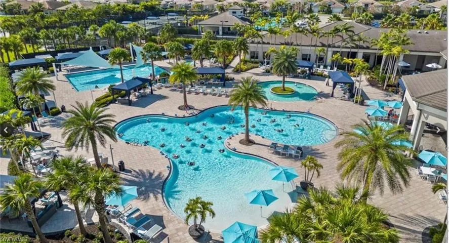 Community pool with a patio