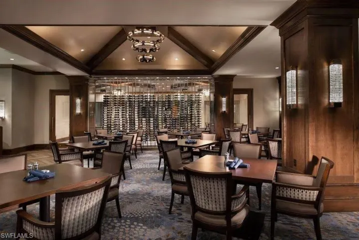 Dining space featuring beam ceiling and ornamental molding