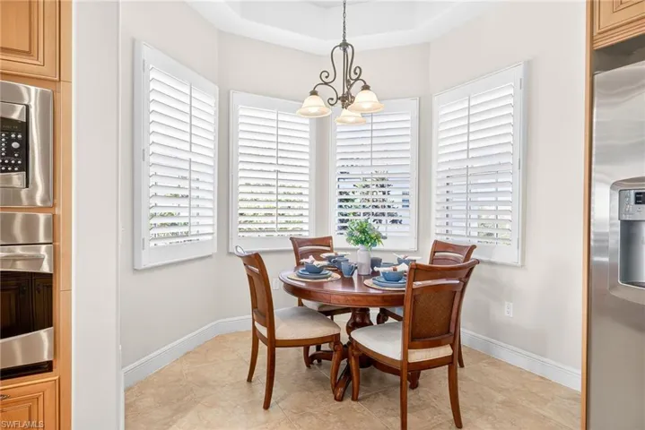 Dining space with a chandelier and healthy amount of natural light