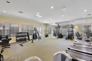 Workout area featuring recessed lighting