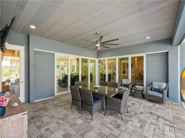 View of patio / terrace with outdoor dining area and ceiling fan