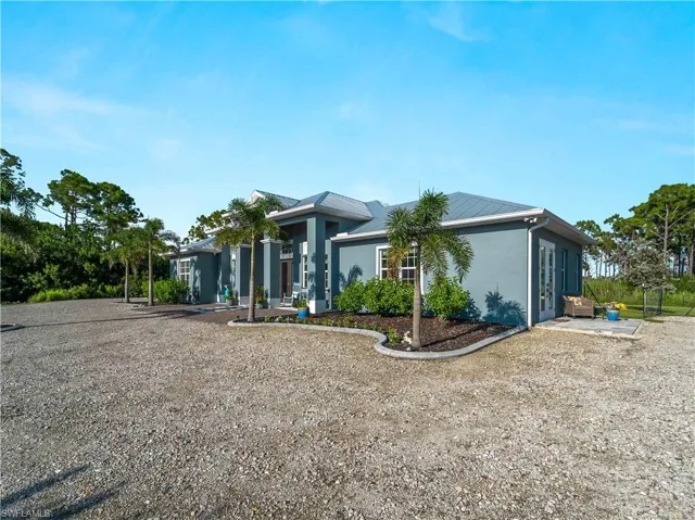 View of front of home featuring stucco siding