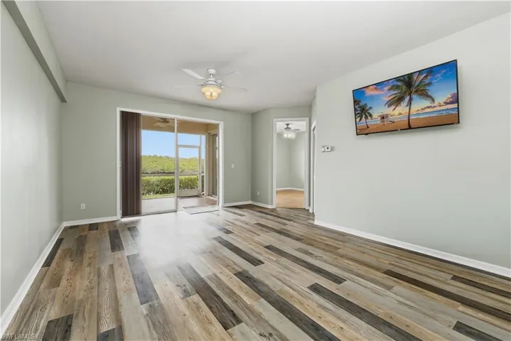 Unfurnished room with light wood-style floors and ceiling fan