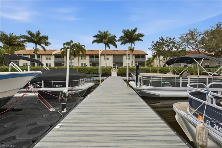 Dock area with a water view and boat ramp