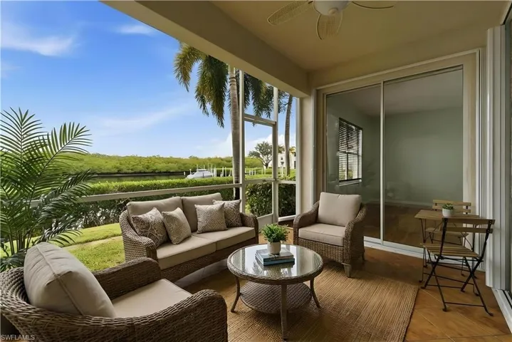 Staged patio featuring a ceiling fan and outdoor lounge area