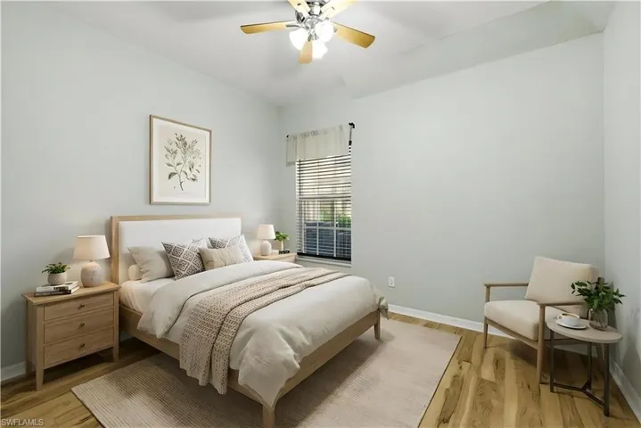 Staged Bedroom featuring light wood finished floors and ceiling fan