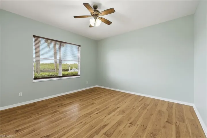 Unfurnished room featuring light wood finished floors and ceiling fan