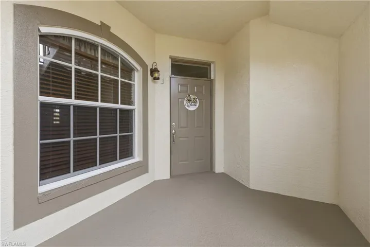 Property entrance with stucco siding
