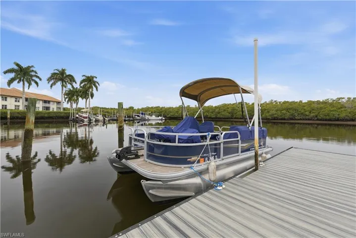Dock featuring a water view and assigned boat ramp