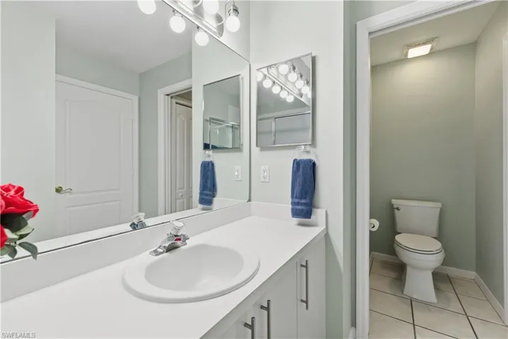 Bathroom featuring separate door to the toilet