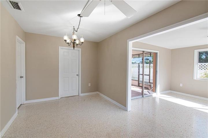 eat in kitchen area and sun room view with slider on to patio