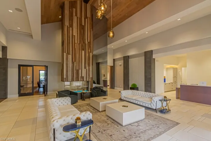 Reception area of the Barrel House with floor to ceiling fireplace, wine lockers, & dining room