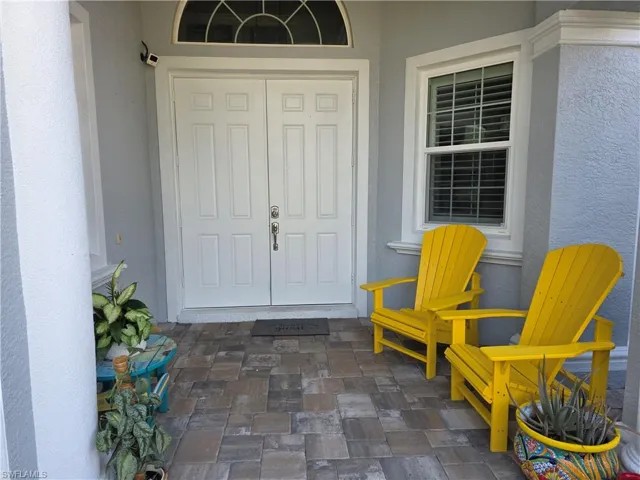 Doorway to property with stucco siding
