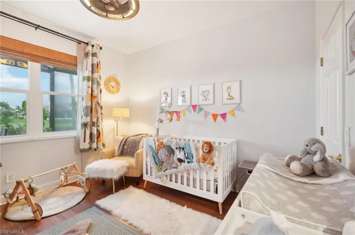Bedroom featuring baseboards and wood finished floors